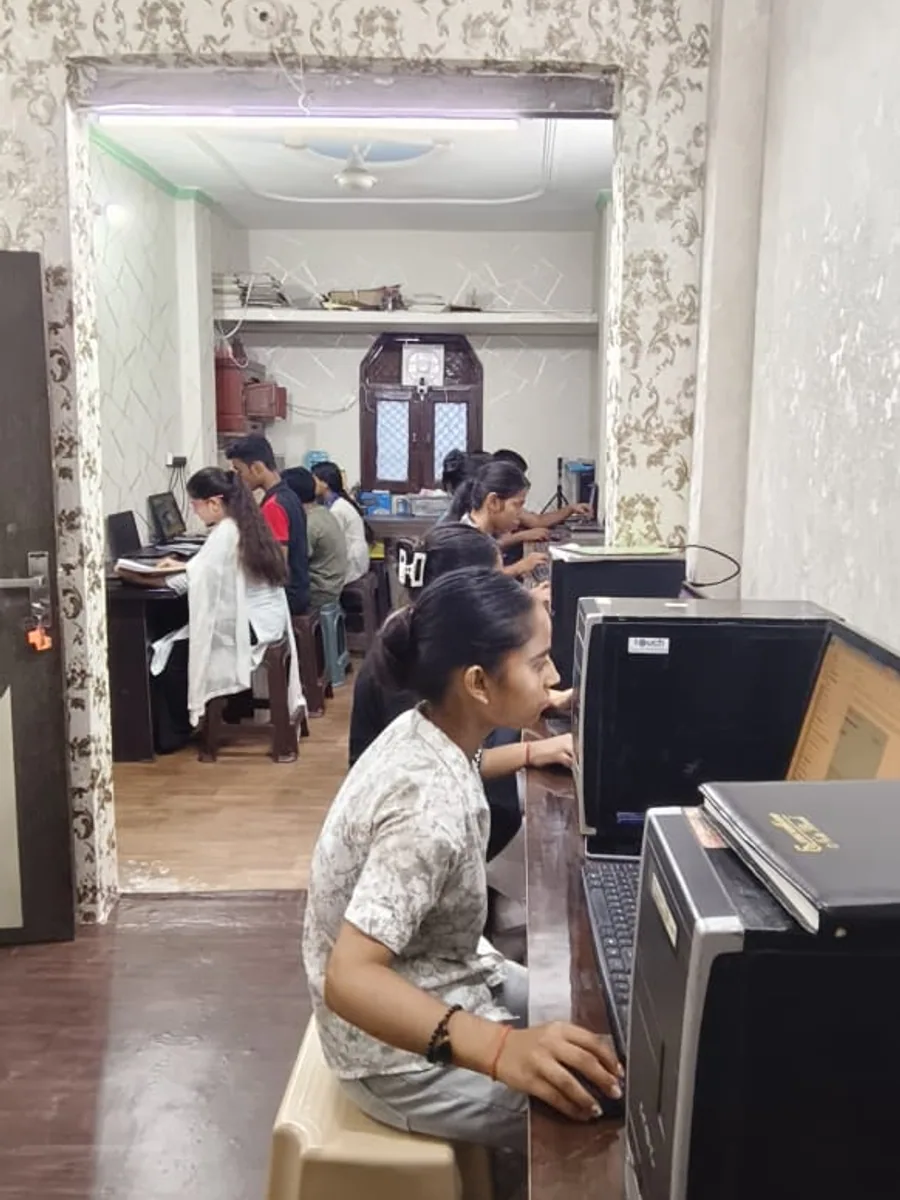 Students learning computer applications at MICE